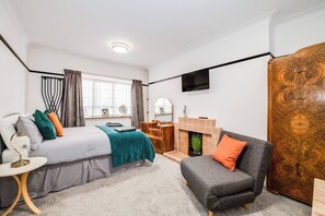 1 bedroom, desk, iron/ironing board, travel crib