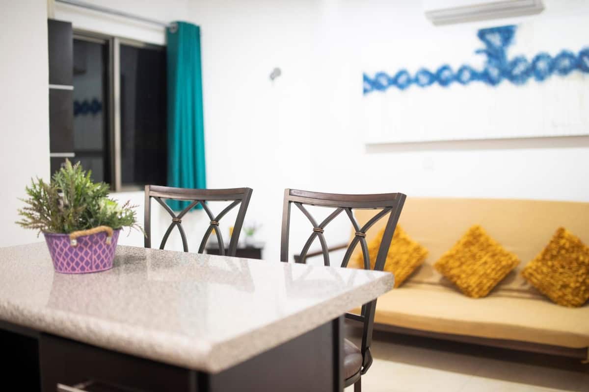 deluxe apartment, multiple beds, kitchen | living area | 40-inch smart tv with digital channels, netflix, streaming services