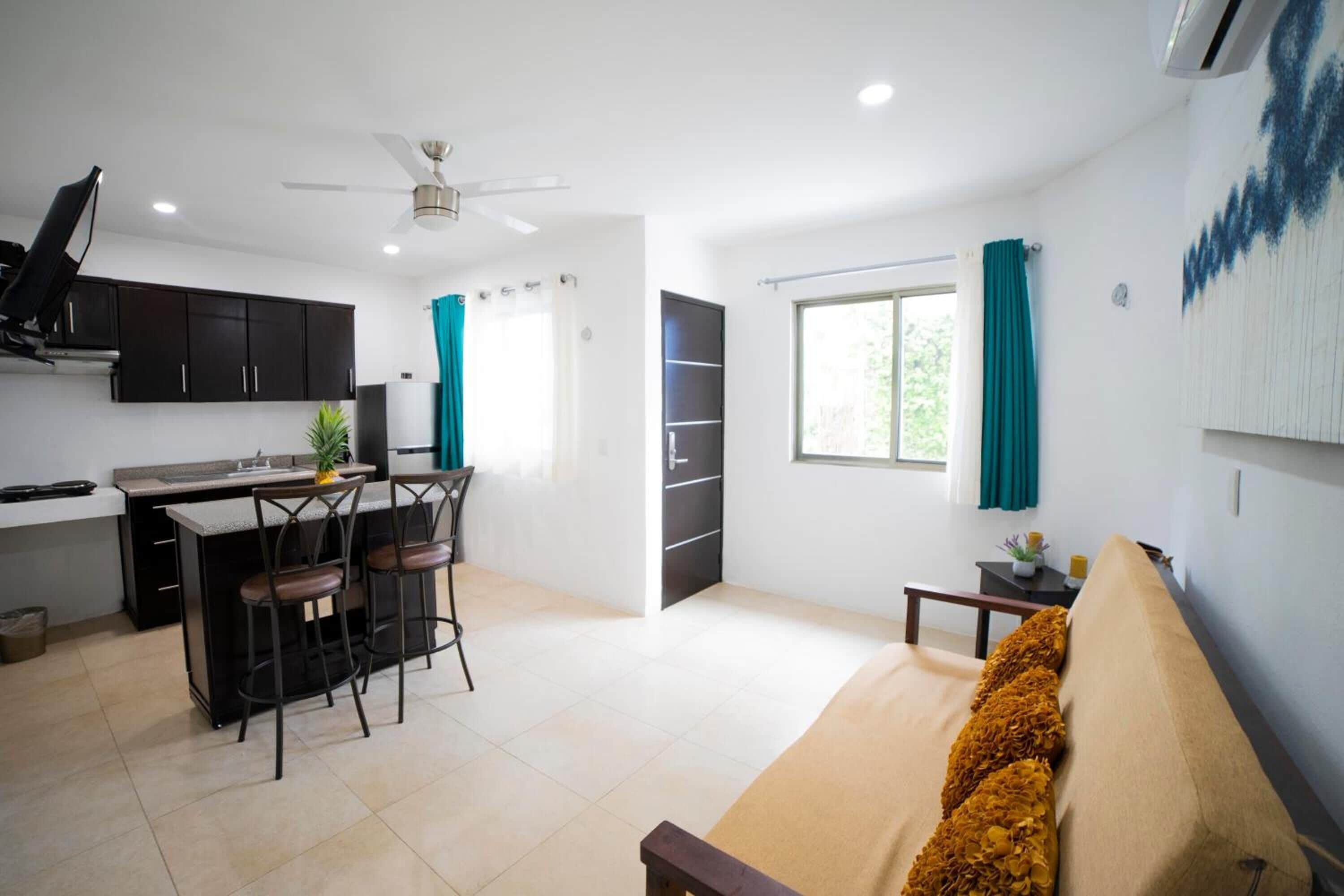 deluxe apartment, multiple beds, kitchen | living room | 40-inch smart tv with digital channels, netflix, streaming services