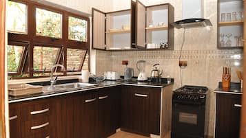 Departamento familiar, 2 habitaciones | Cocina privada | Refrigerador, microondas, horno y parrilla de estufa