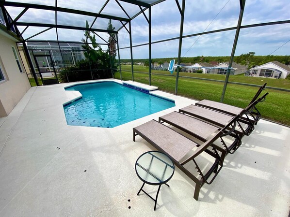 A heated pool, pool loungers