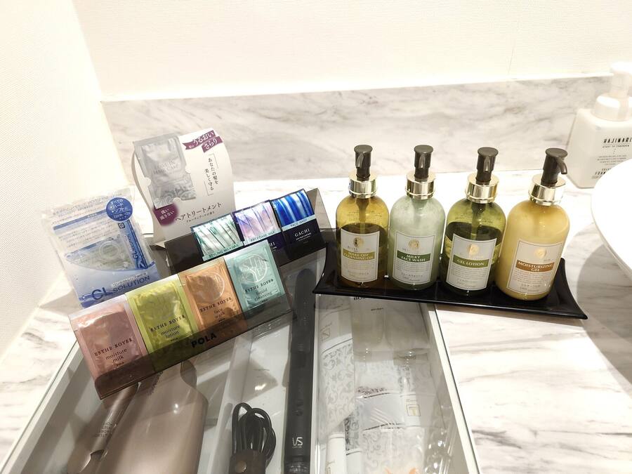 A display of skincare products including face wash, cleansing oil, and lotion.