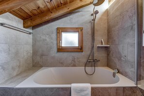 Bathtub, hair dryer, towels