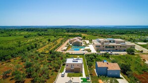 A residential area with a large building featuring a basketball court, a swimming pool, and a tennis court. - Gorgeous home in Vodnjan (Vodnjan)