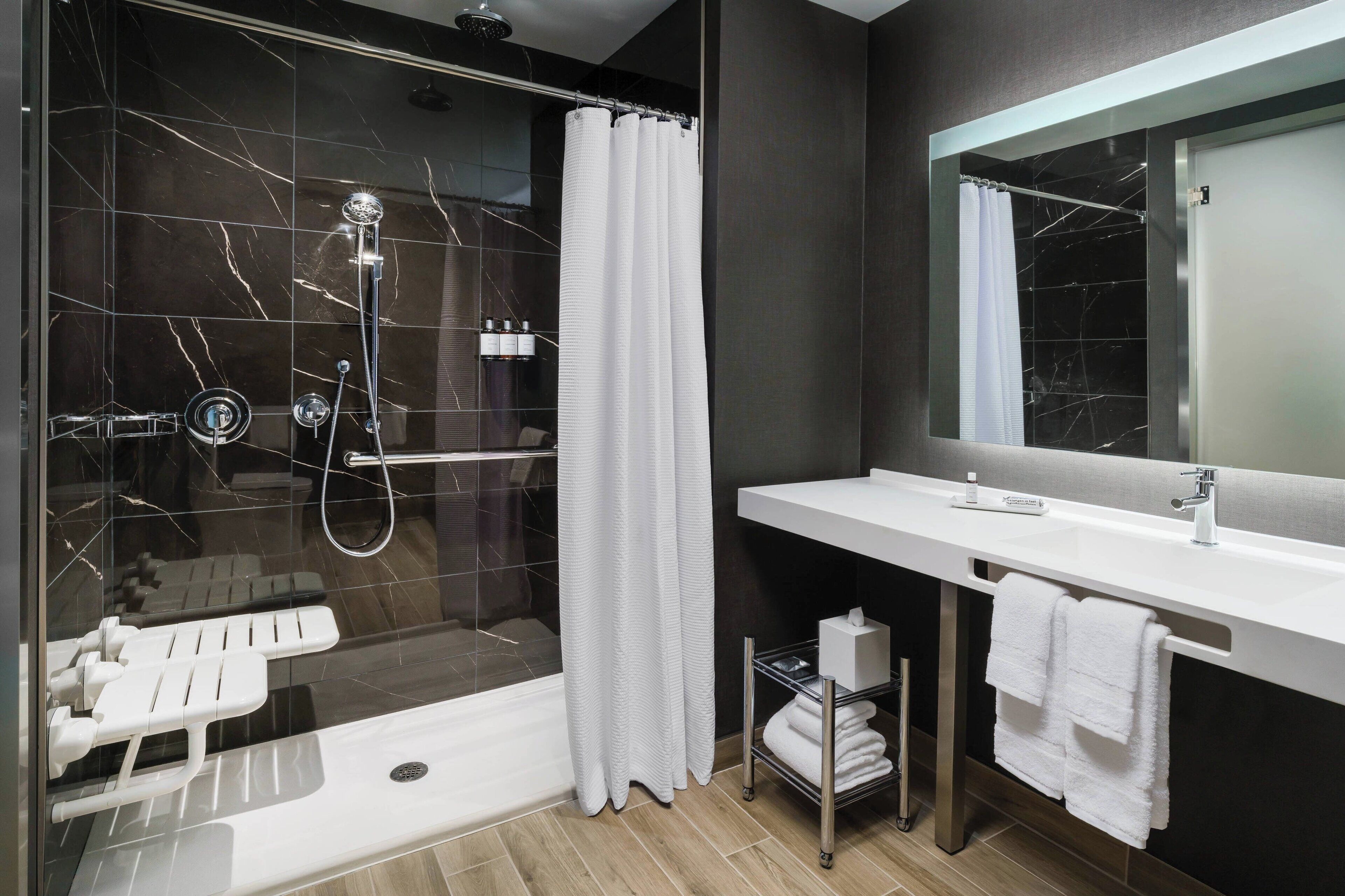 shower, hydromassage showerhead, designer toiletries, hair dryer