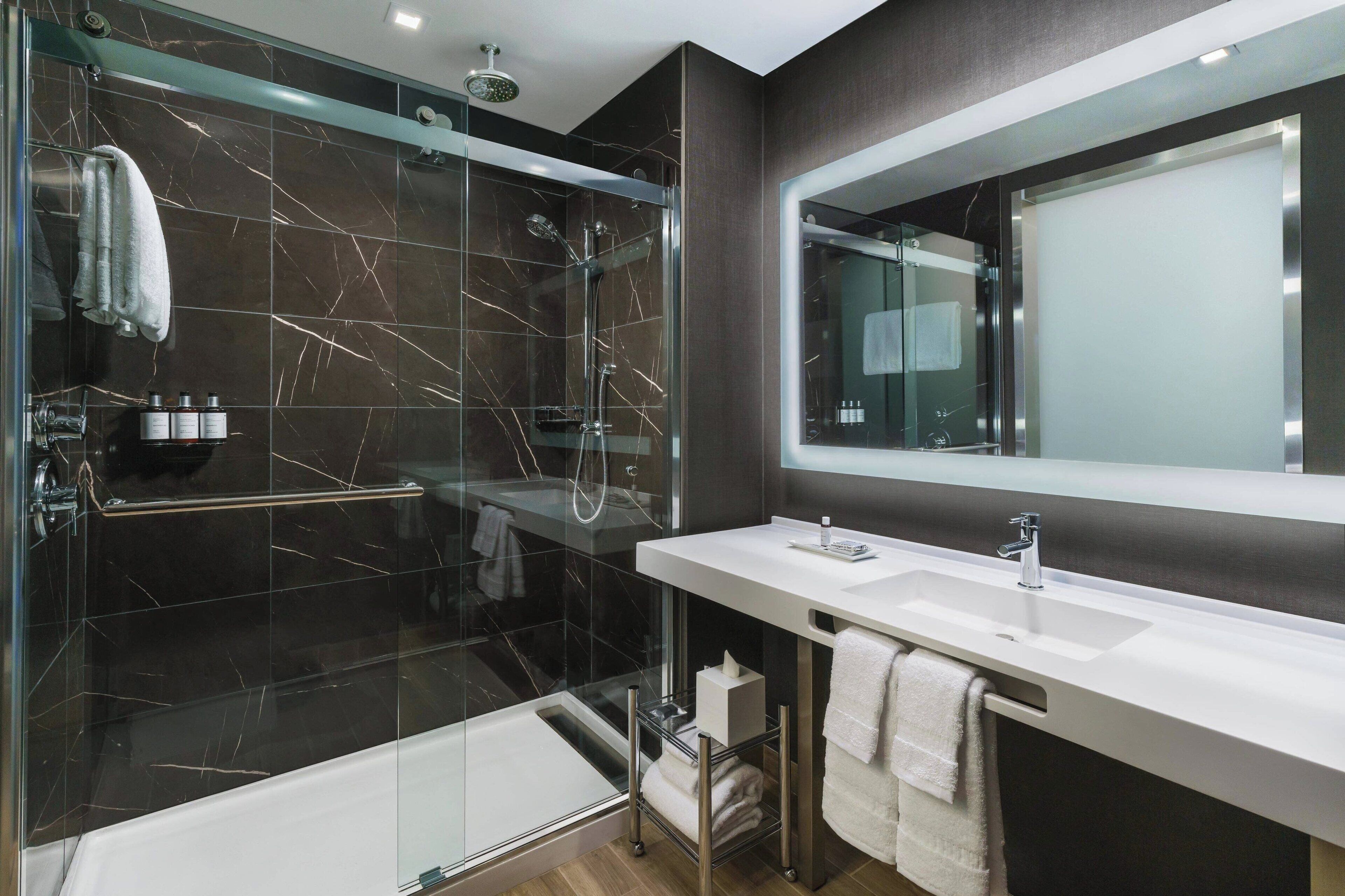 shower, hydromassage showerhead, designer toiletries, hair dryer