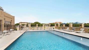 Outdoor pool, open 7:00 AM to 10:00 PM, pool loungers