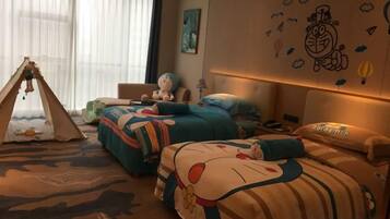 A hotel room with two beds, a tent, and a large window with curtains.