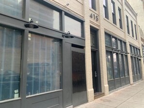 415 Building features large windows and a brick facade in a modern urban setting.
