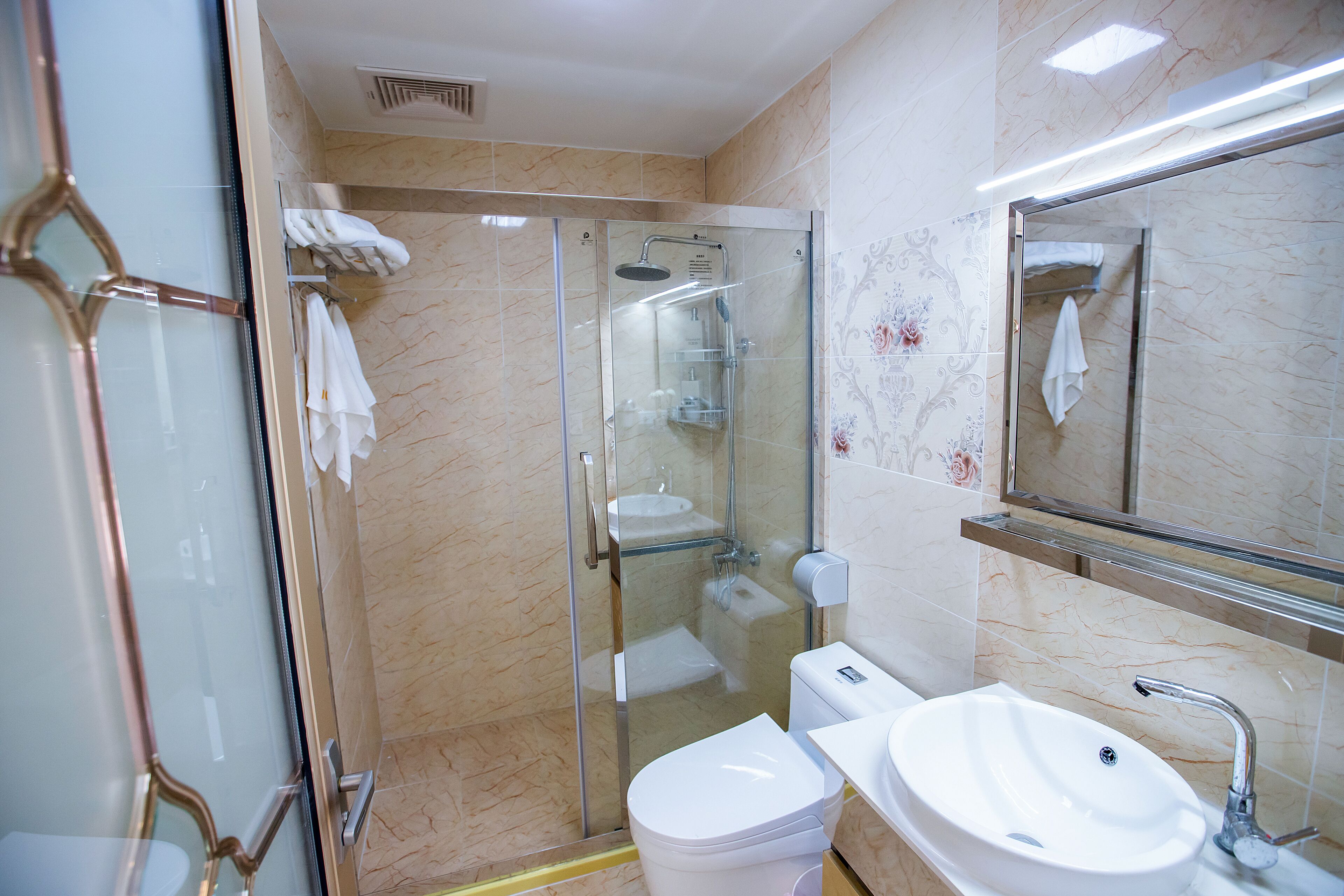 Shower, free toiletries, slippers, towels