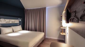 Blackout drapes, soundproofing, iron/ironing board, free WiFi