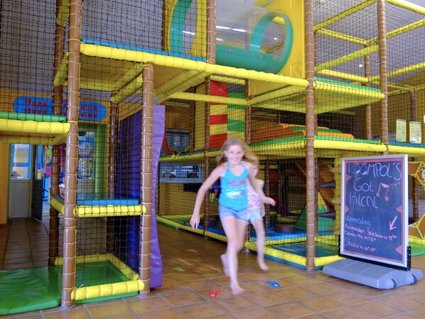 An indoor play area with a climbing structure and a chalkboard sign. - Restyled Villa with Washing Machine near River Moselle (Ediger-Eller)