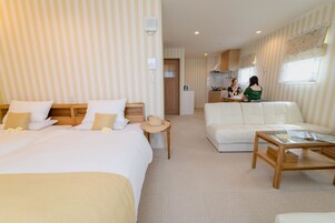 Standard Quadruple Room | In-room safe, desk, laptop workspace, blackout drapes