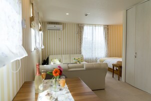 Standard Quadruple Room | In-room safe, desk, laptop workspace, blackout drapes