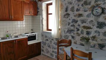 Apartment, 2 Bedrooms | Private kitchen | Full-sized fridge, oven, stovetop, cookware/dishes/utensils