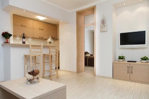 Apartamento luxo | Área de estar | TV LCD 32 polegadas com canais a cabo, TV