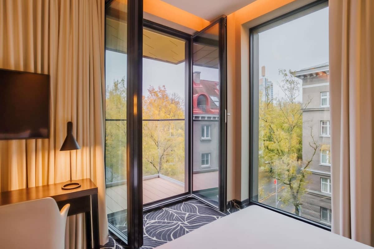 Executive Suite, 1 Double Bed, Balcony | Minibar, in-room safe, desk, laptop workspace
