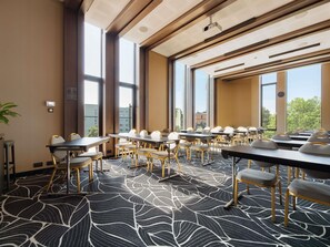 A conference room with large windows, a patterned carpet, and modern furniture. - Mövenpick Hotel Tallinn (Tallinn)