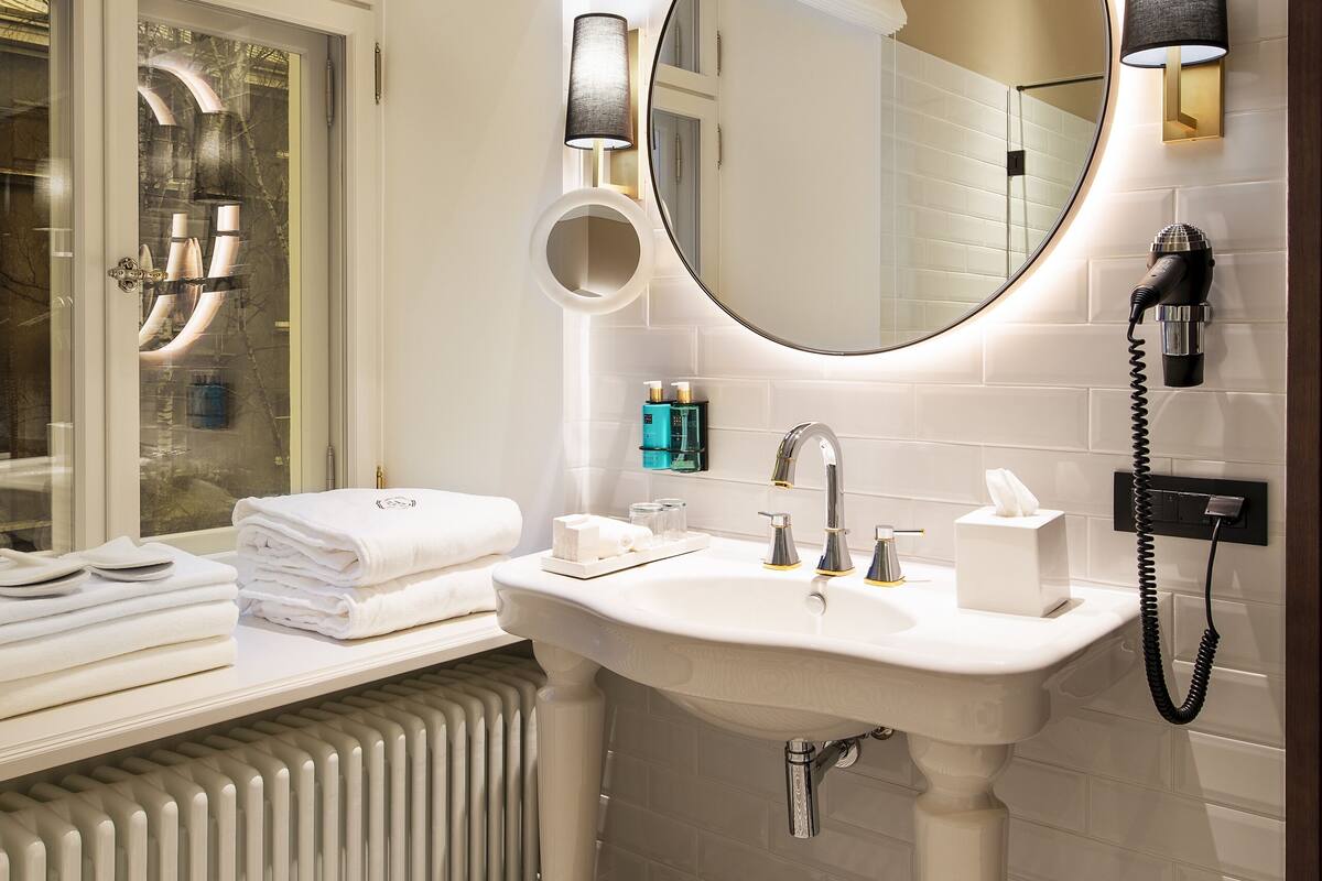 eco-friendly toiletries, hair dryer, bathrobes, slippers