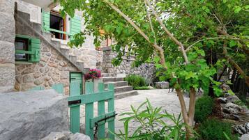 House, 1 Bedroom, Balcony, Garden View | Property grounds