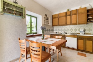 Ferienhaus, 1 Schlafzimmer, Balkon, Gartenblick | Eigene Küche