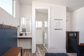 Bungalow King with Sofa Couch | Bathroom | Shower, hair dryer, towels