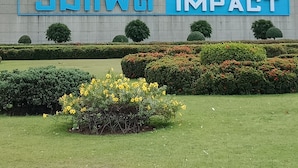 A building with a large sign reading 'SWING IMPACT'. - Room-impact Don Mueang Bangkok Guest Hou (Pak Kret)