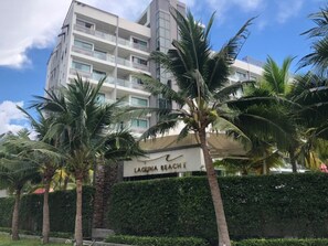 A multi-story hotel with a sign reading "Laguna Beach".