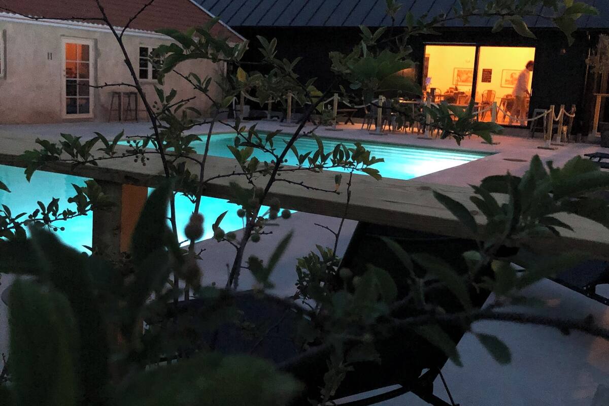 A pool area with a building in the background.