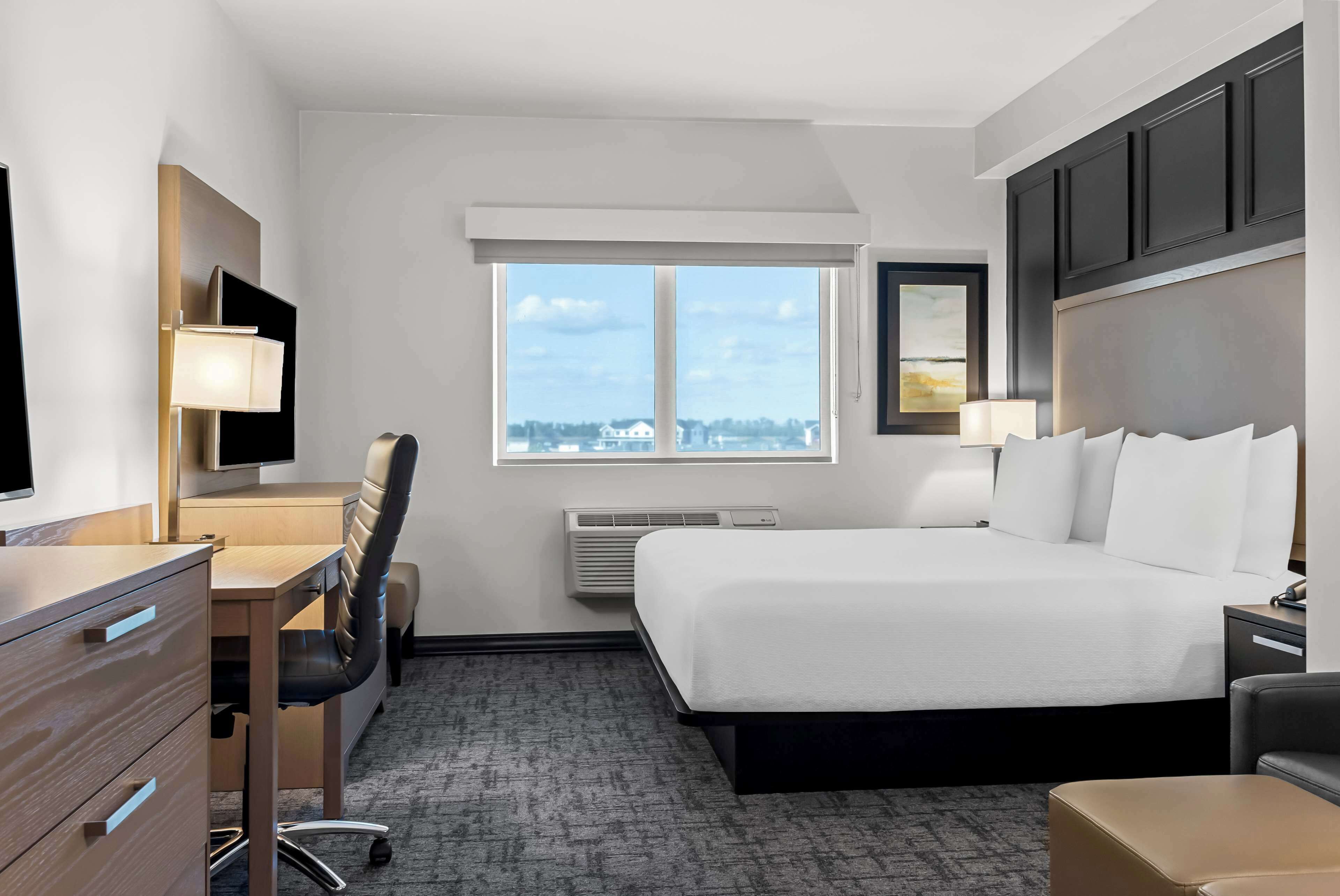 suite, 1 king bed, accessible, refrigerator & microwave (with sofabed) | 1 bedroom, pillow-top beds, desk, laptop workspace