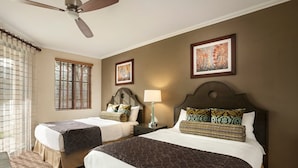 A hotel room with two beds, a ceiling fan, a window with blinds, and artwork on the walls. - Christmas Welk San Diego California 2 bedroom Lock Off (San Diego)