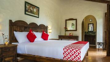 Tabla de planchar con plancha y ropa de cama