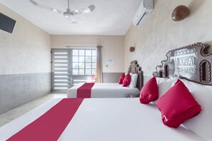 Standard Room, 2 Double Beds | Living area | 28-inch TV with satellite channels - Hotel Tapia (Buctzotz)