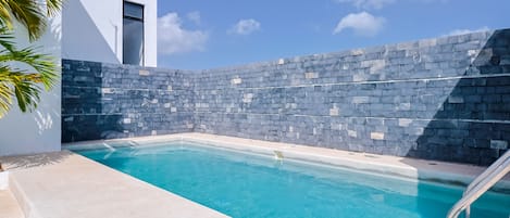 Outdoor pool, pool umbrellas, pool loungers