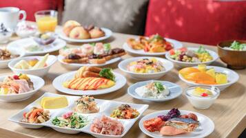 A variety of dishes on a table, suggesting a buffet or meal setting.