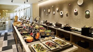 A buffet setup with various food items and utensils. - The Royal Park Hotel Kyoto Umekoji (Kyoto)