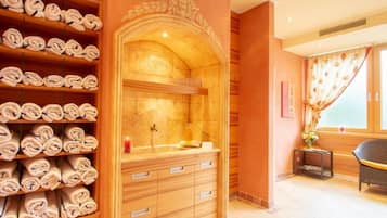 Bathroom features a central sink area, decorative arch, and window with curtains.