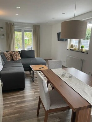 Comfort Condo | Living area | 50-cm flat-screen TV with cable channels