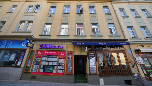 A multi-story building with EXIMTOURS and MATONI shops on the ground floor. - Apartment No. 10 Zeyerova 13 (Karlovy Vary)