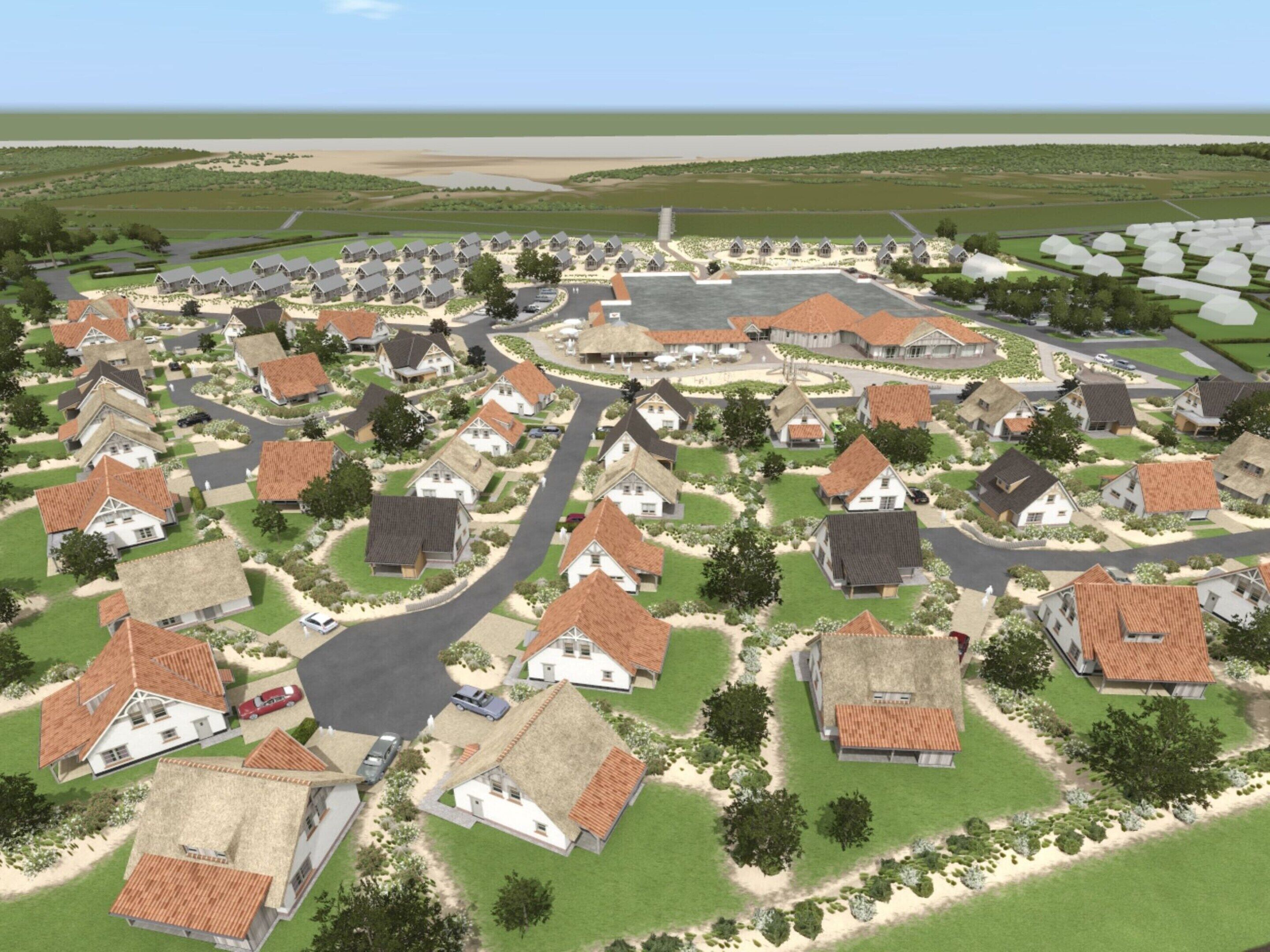 A village with traditional houses, narrow roads, and a central square.