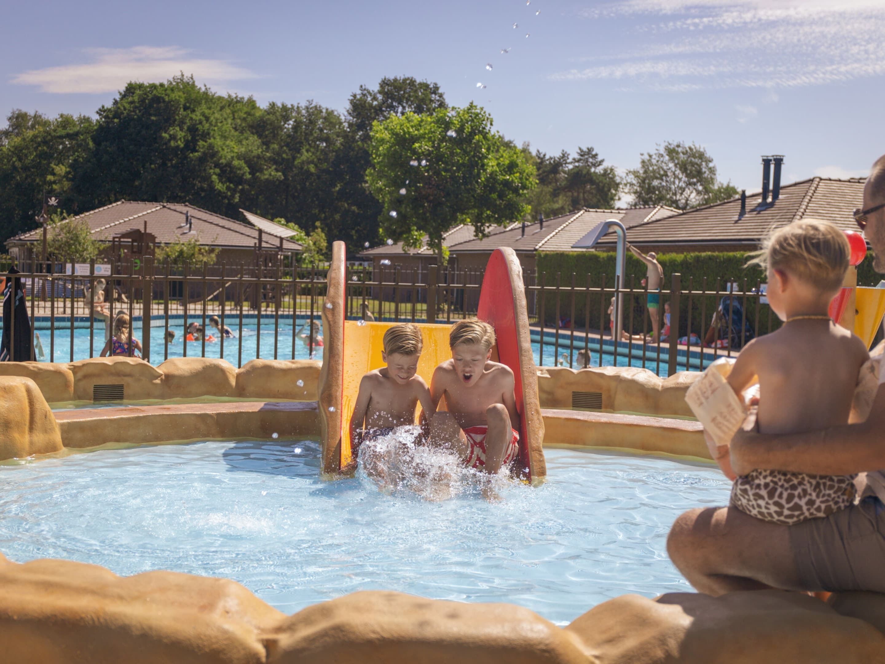 A water play area with slides and a pool.