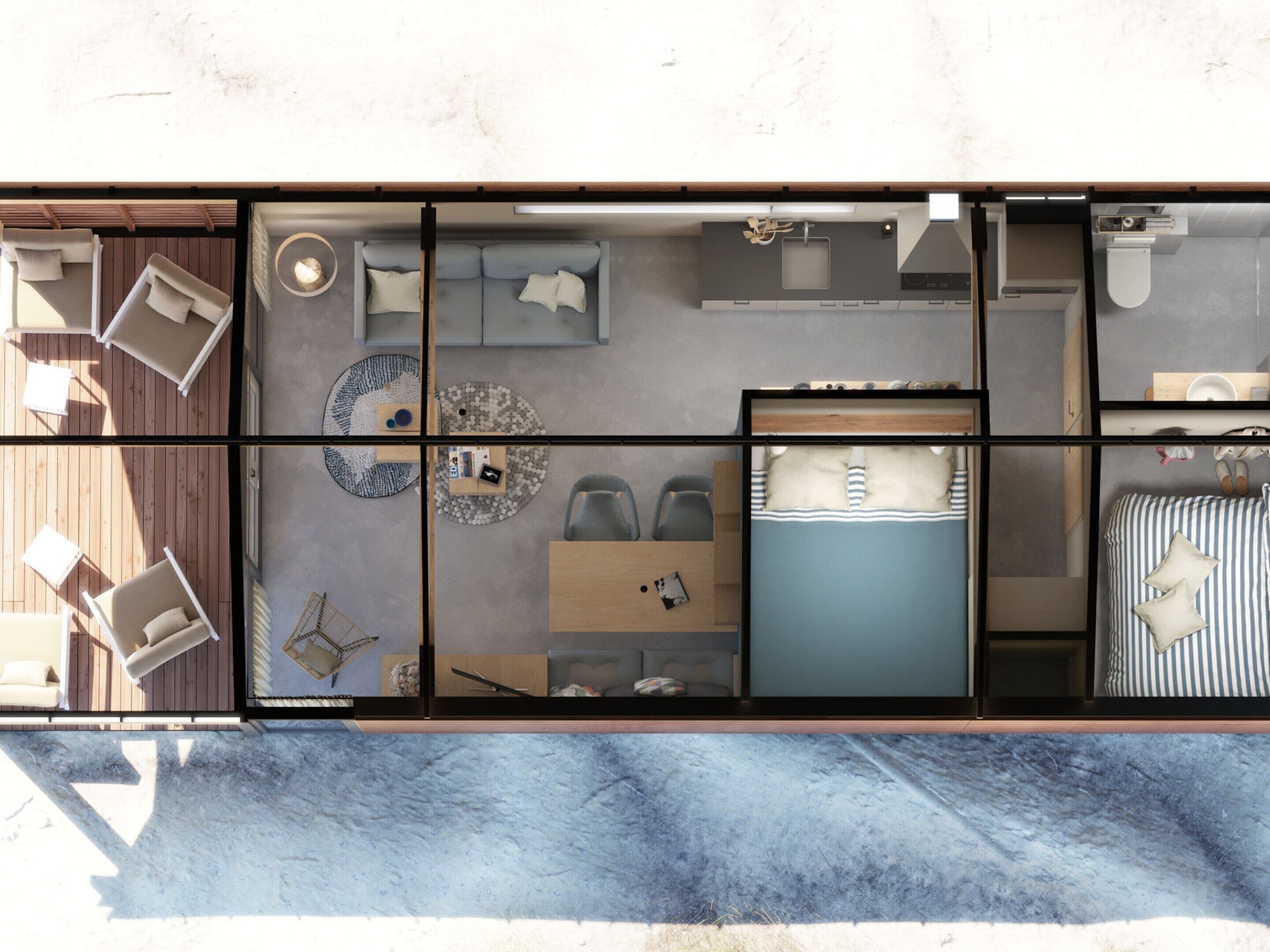 Un intérieur moderne comprenant un lit, un coin salon et une petite kitchenette.