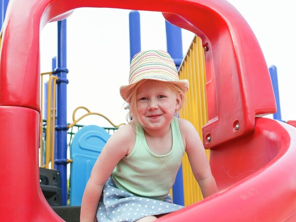 A child on a playground slide.