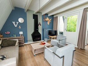 Bangalô | Área de estar | TV de tela plana