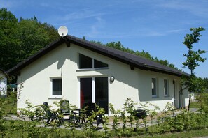 A single-story building with a sloped roof, a satellite dish, and a door with a red frame. - Bungalow Near Eifel Ski Lift (Gerolstein)