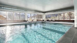 An indoor swimming pool with clear windows, white walls, and a tiled floor. - Chalet in Praroustan With Stunning Mountain Views (Uvernet-Fours)
