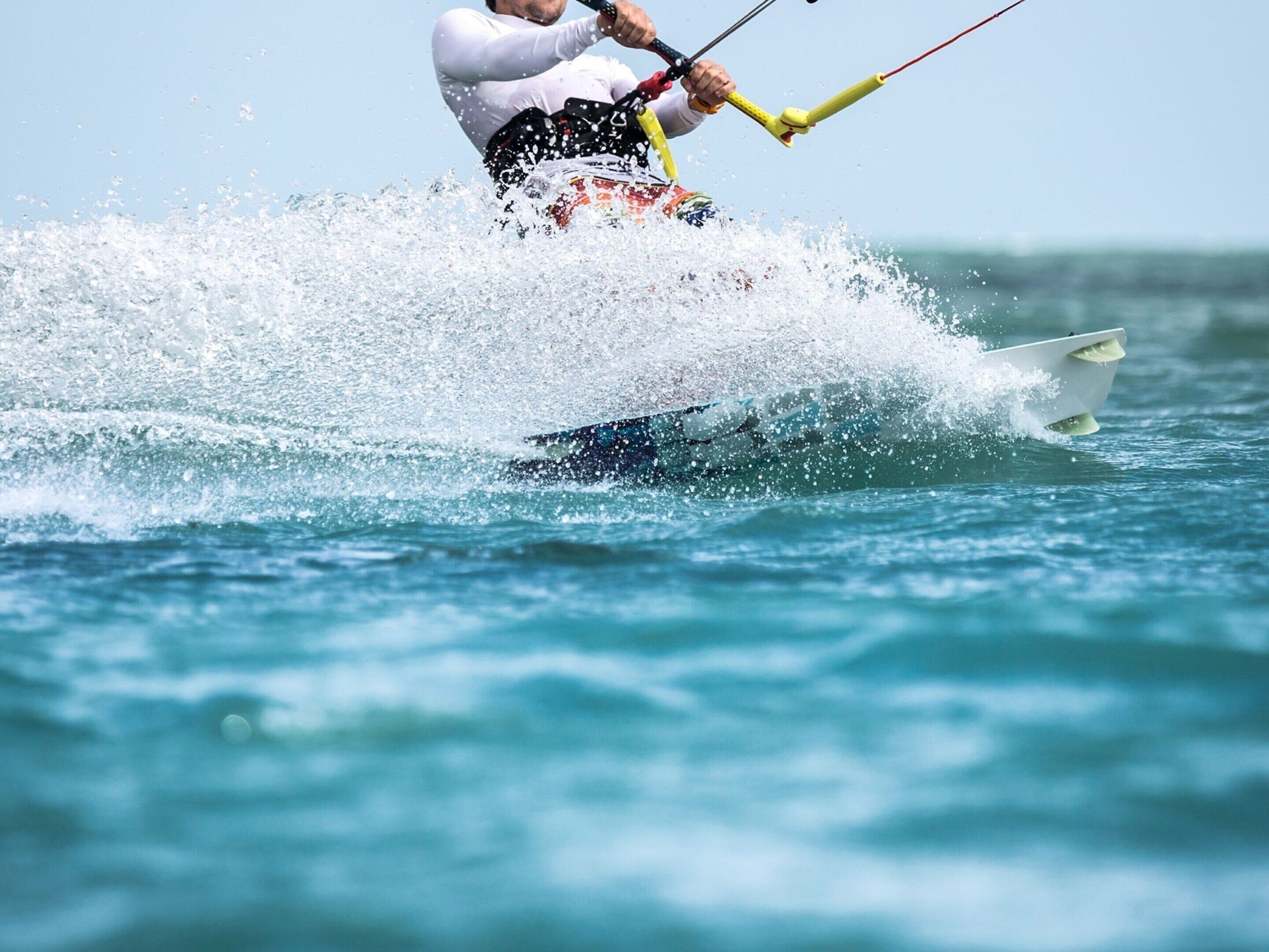 A person water skiing on a body of water.