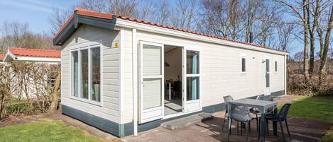 A single-story mobile home with a patio area.