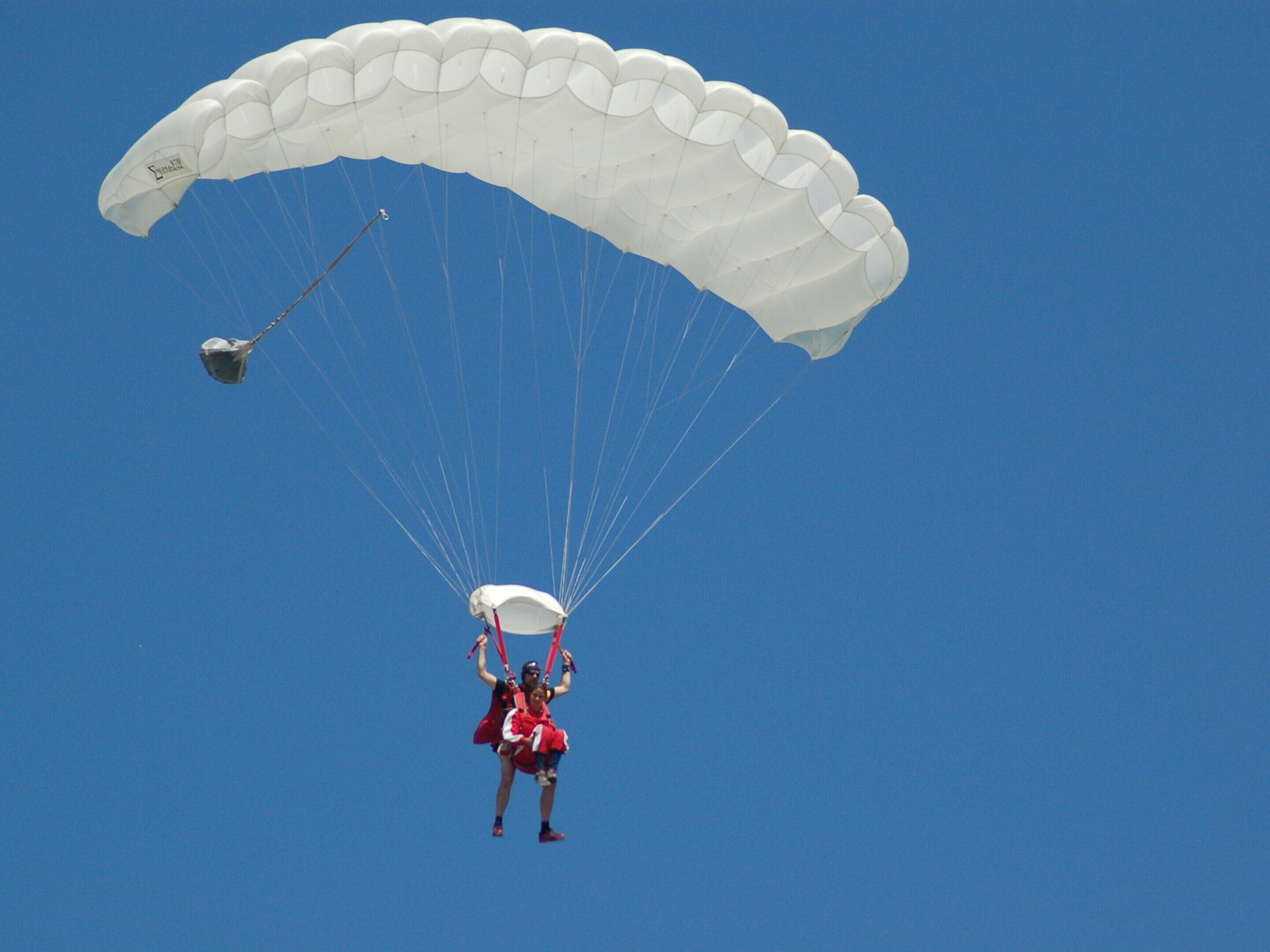 A person parachuting with a parachute.