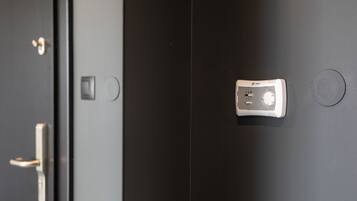 A door with a modern electronic lock and a keyhole.